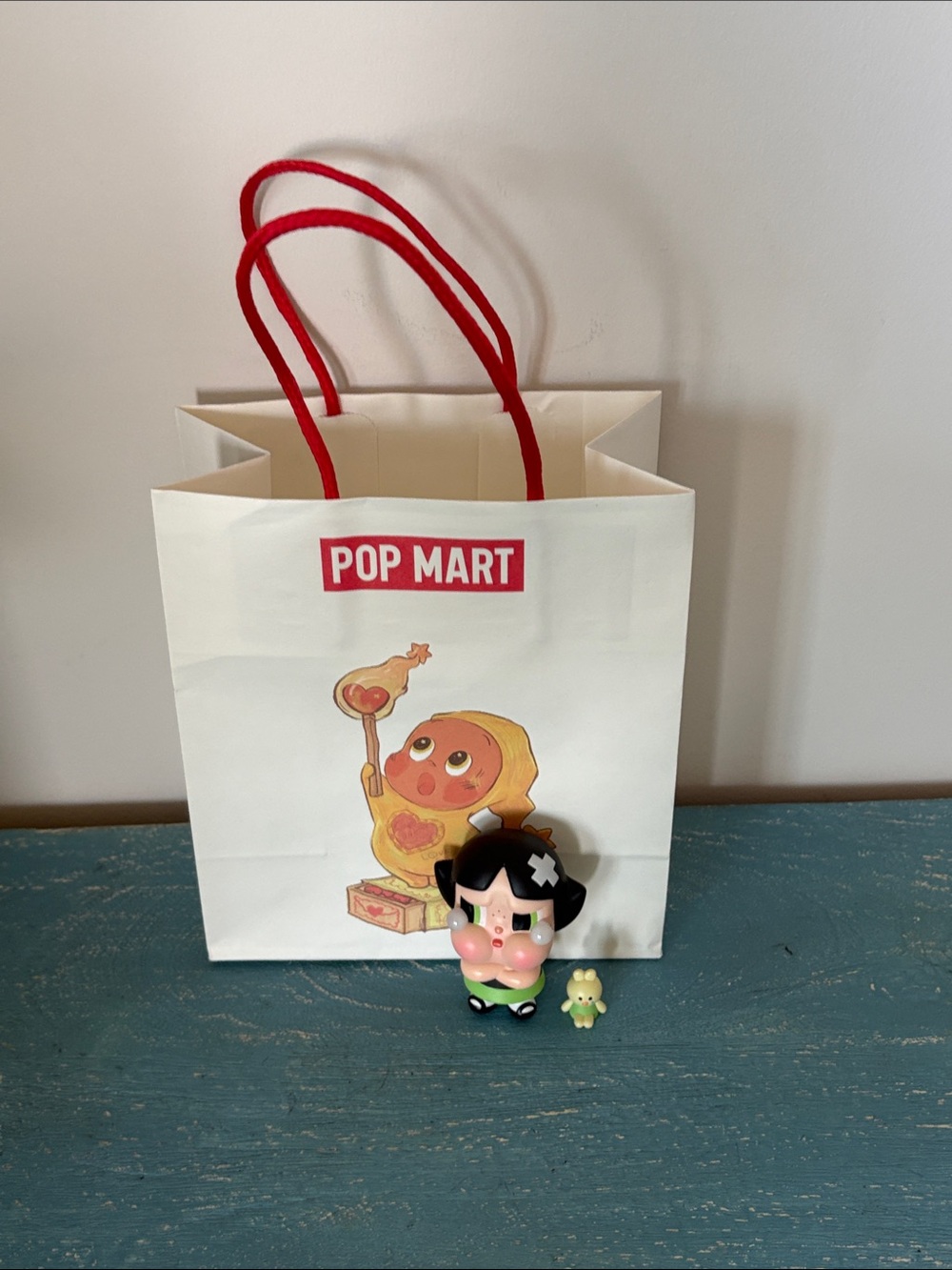 Pop Mart, crybaby powder, puff girl, figurine, and bag